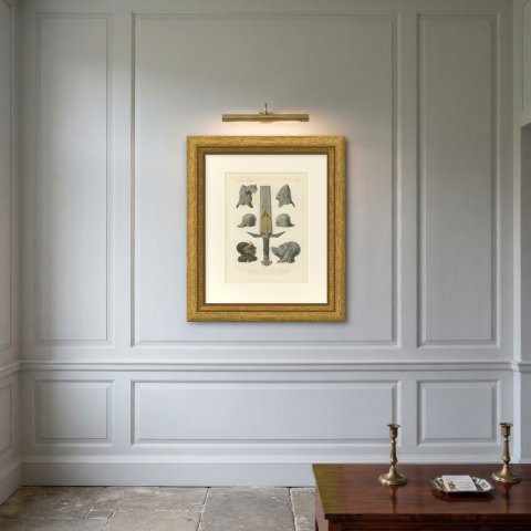 Medieval Helmets and a German Sword, Antique Print, 1851, shown framed on a wall